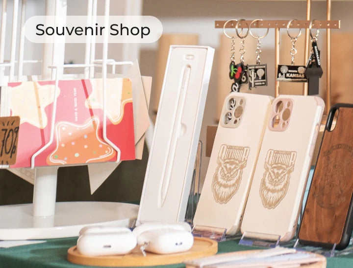 Display of wooden phone cases and other souvenirs in a souvenir shop.